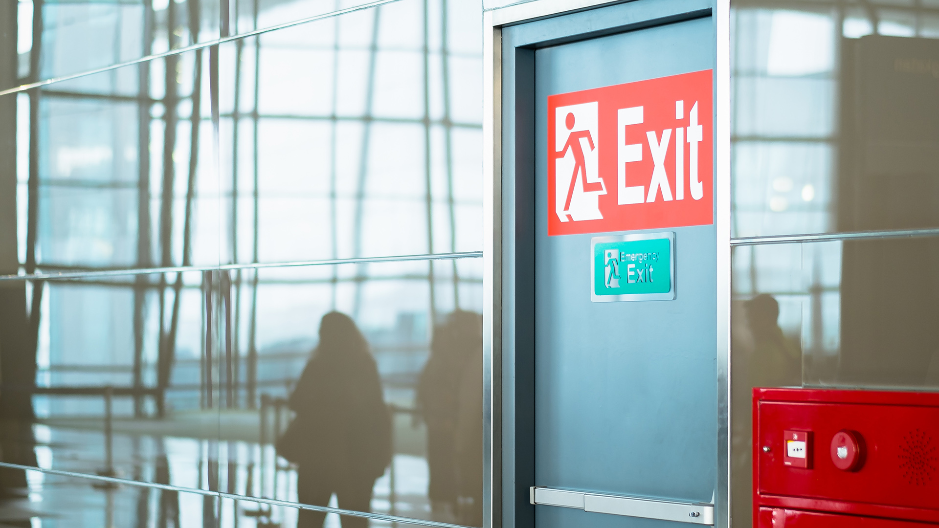 Emergency exit with people walking by